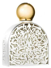 Secret of Love Spiritual Eau de Parfum bottle by Maison Micallef, featuring a gold cap and intricate lattice cutouts.